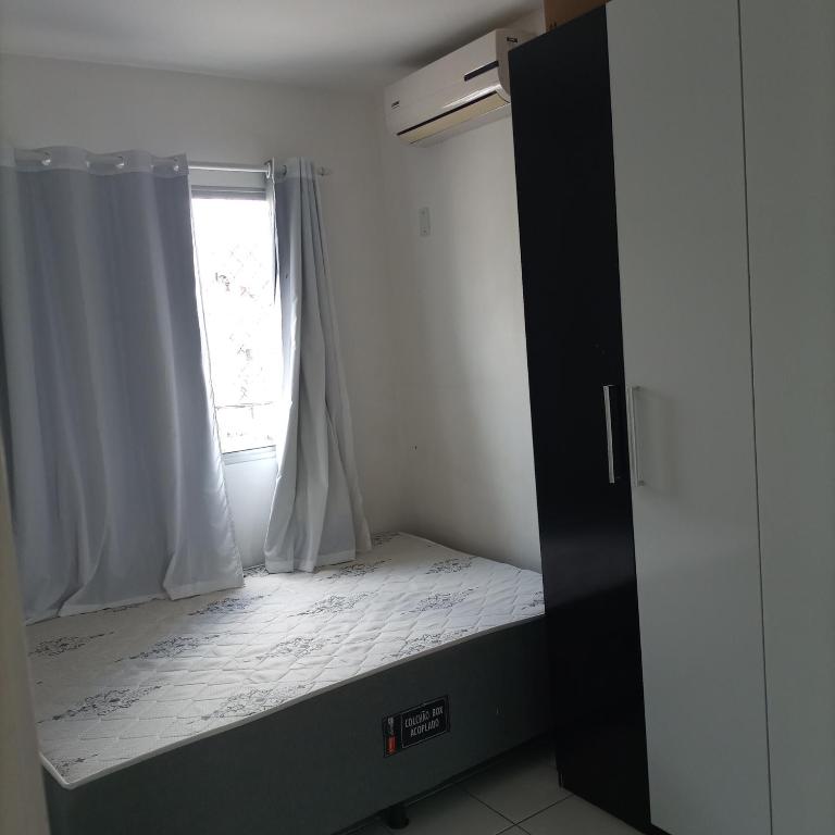 Posteľ alebo postele v izbe v ubytovaní Apartamento no vila Olímpia mobiliado