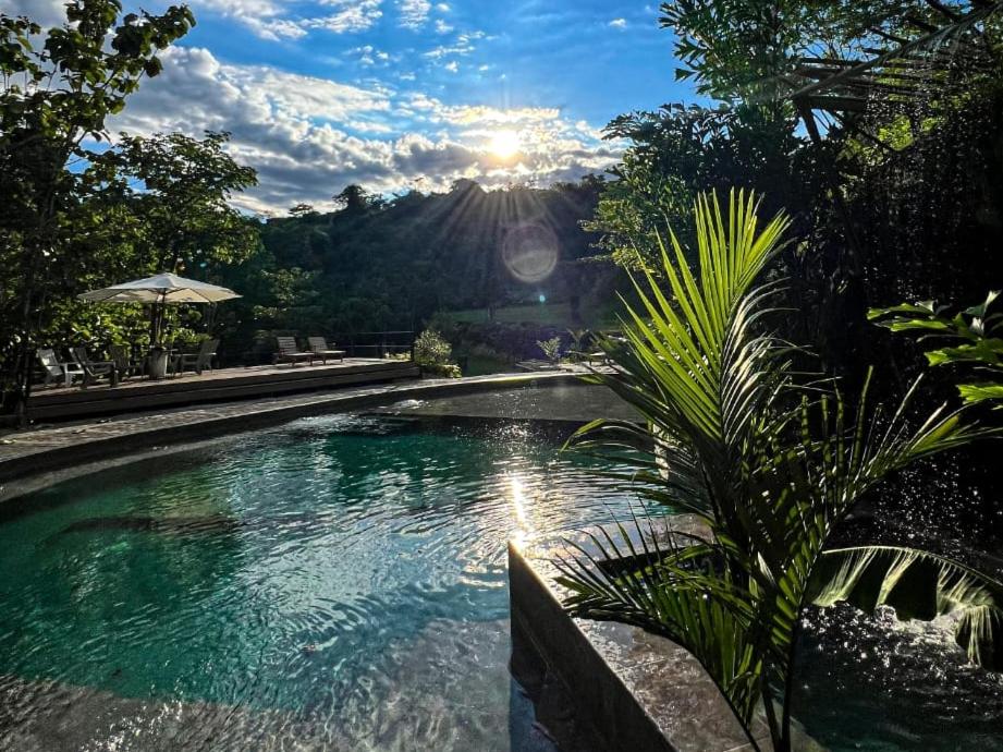 a swimming pool with a view of a mountain at Tuku, in Guarinocito