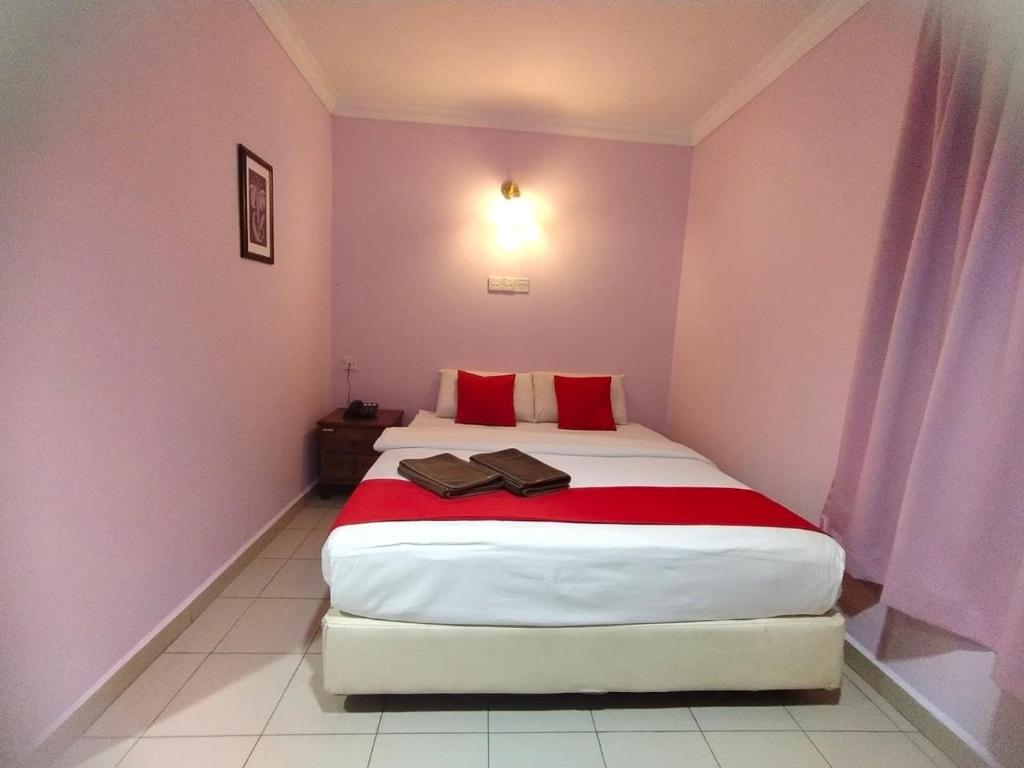 Postel nebo postele na pokoji v ubytování HOTEL PANTAI VIEW
