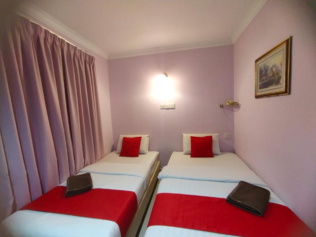 Postel nebo postele na pokoji v ubytování HOTEL PANTAI VIEW