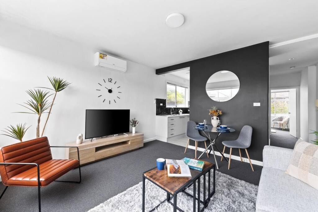 a living room with a couch and a tv at The Bluewater Nest in Melbourne