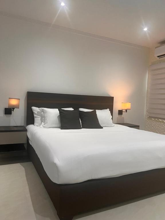 Postel nebo postele na pokoji v ubytování Hotel Zuriel Boutique