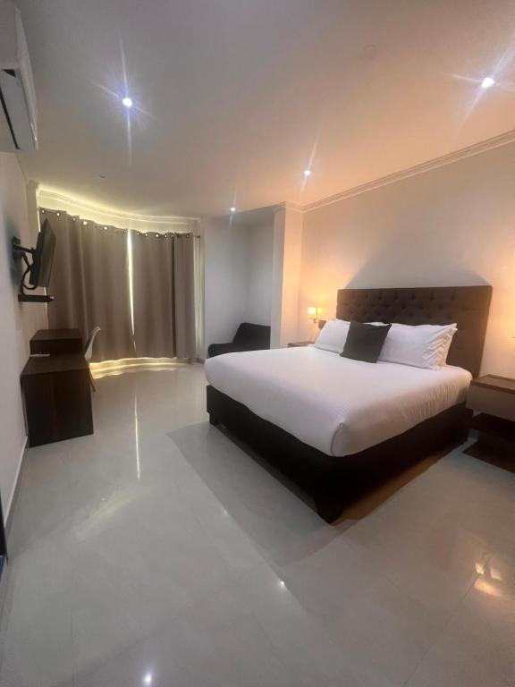 Postel nebo postele na pokoji v ubytování Hotel Zuriel Boutique