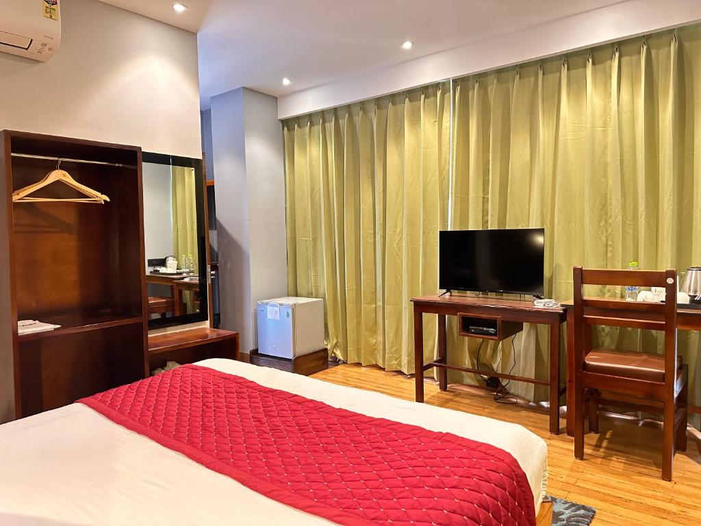 TV a/nebo společenská místnost v ubytování NUMINOUS HOTEL