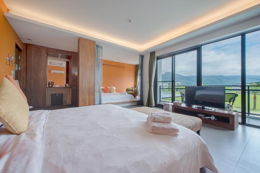 Postel nebo postele na pokoji v ubytování Jiaoxi 320 B&B