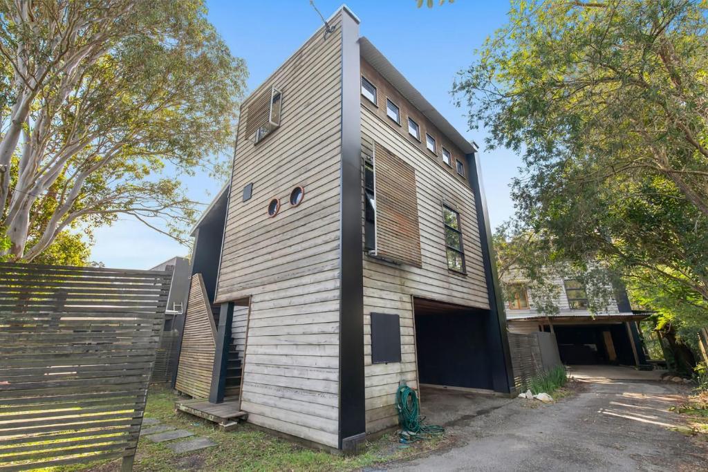 a building with a fence next to it at Kangarilla in Emerald Beach