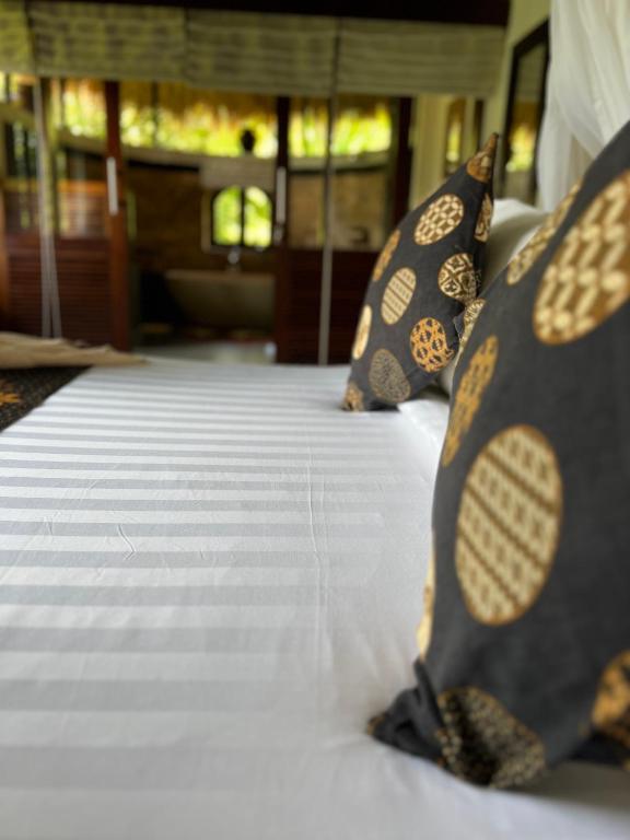 Postel nebo postele na pokoji v ubytování Subak Tabola Villa