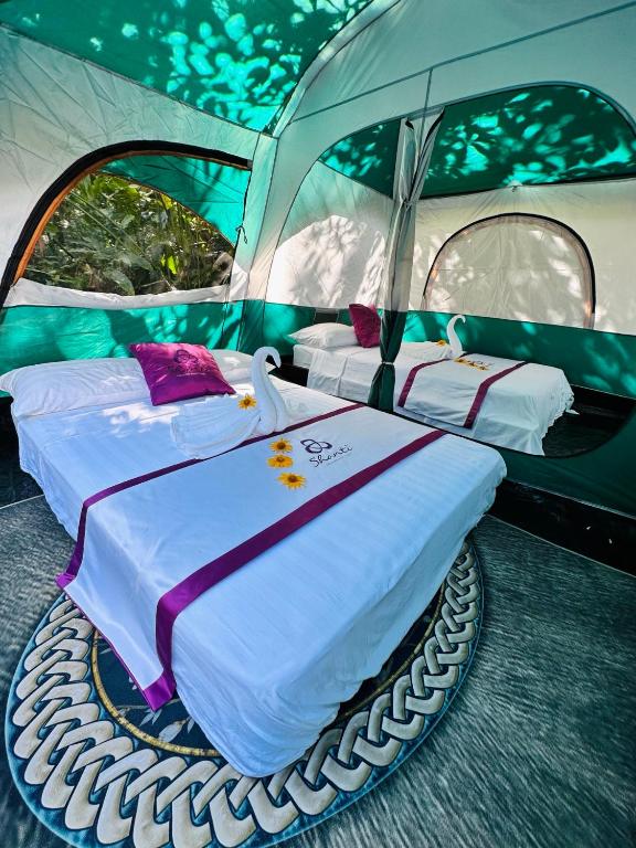 Postel nebo postele na pokoji v ubytování Shanti Wellness Sanctuary