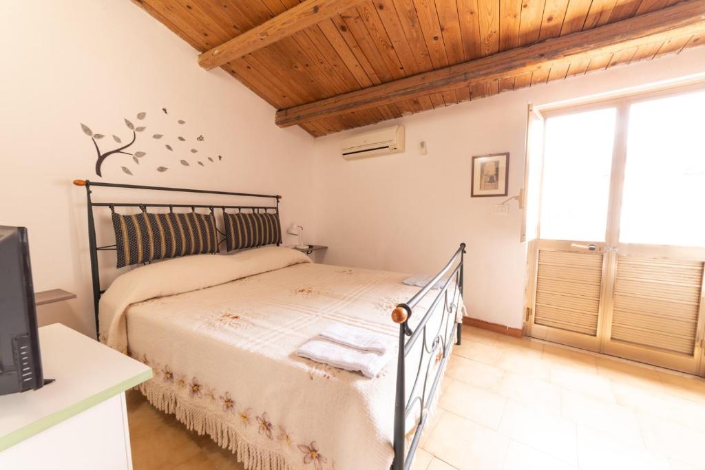 Postel nebo postele na pokoji v ubytování Il Campanile