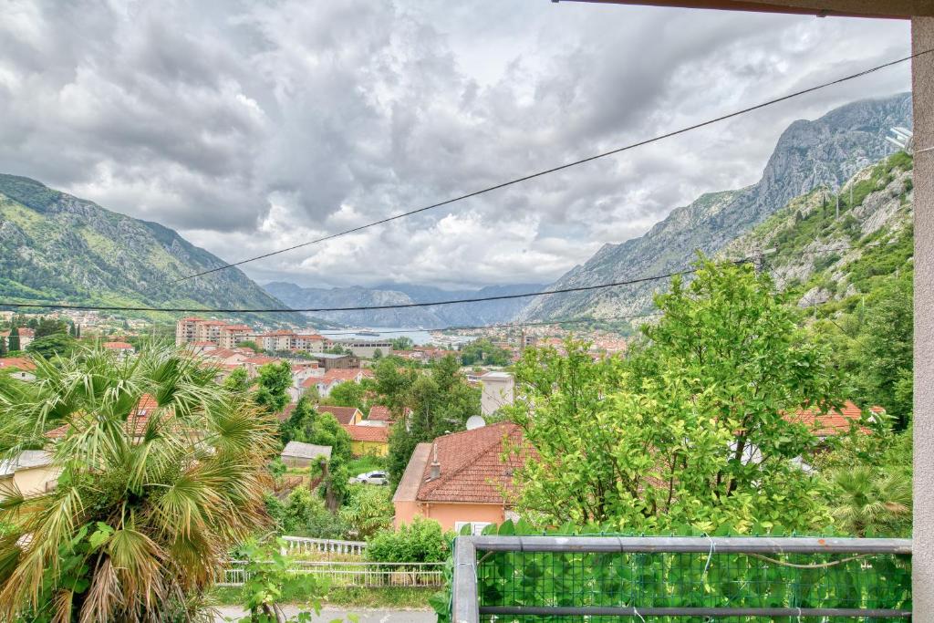 a view of a city with mountains in the background at Guest House Jovana in Kotor