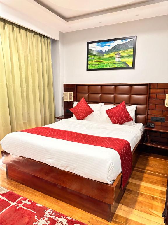 Postel nebo postele na pokoji v ubytování NUMINOUS HOTEL