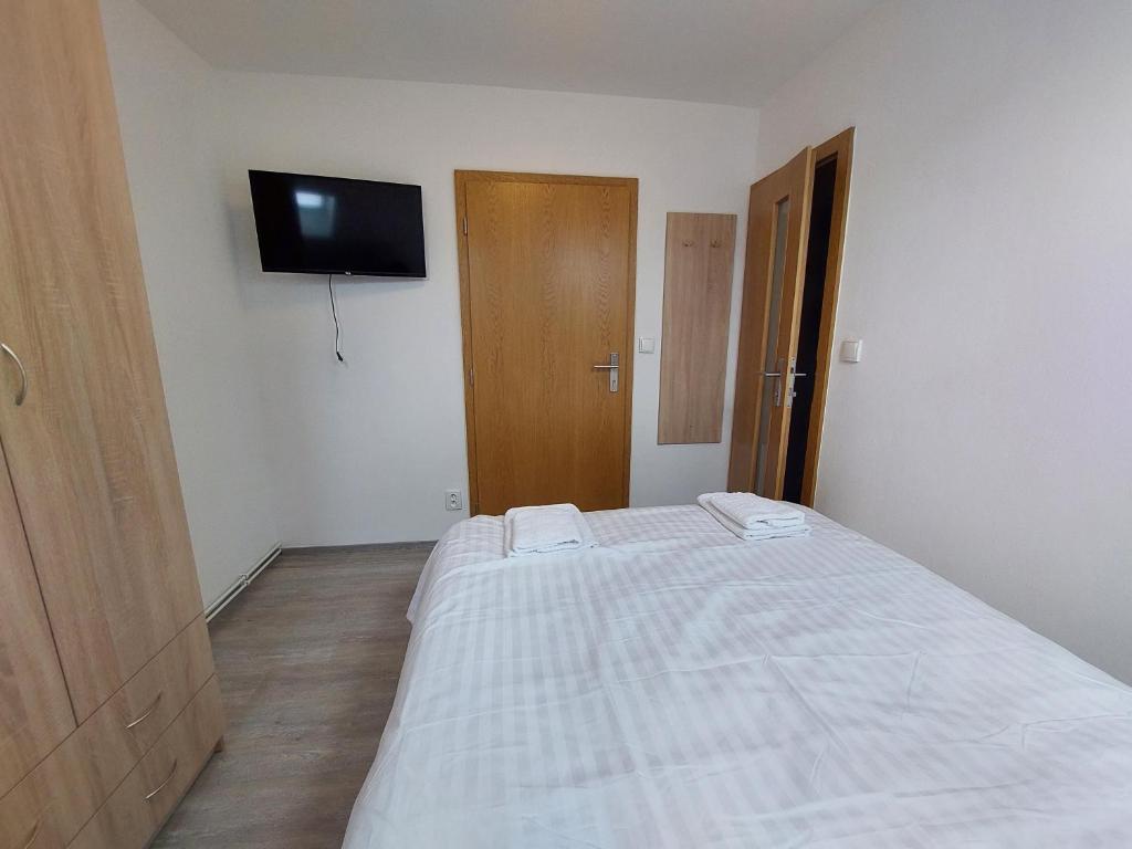 Postel nebo postele na pokoji v ubytování Penzion Strachotín