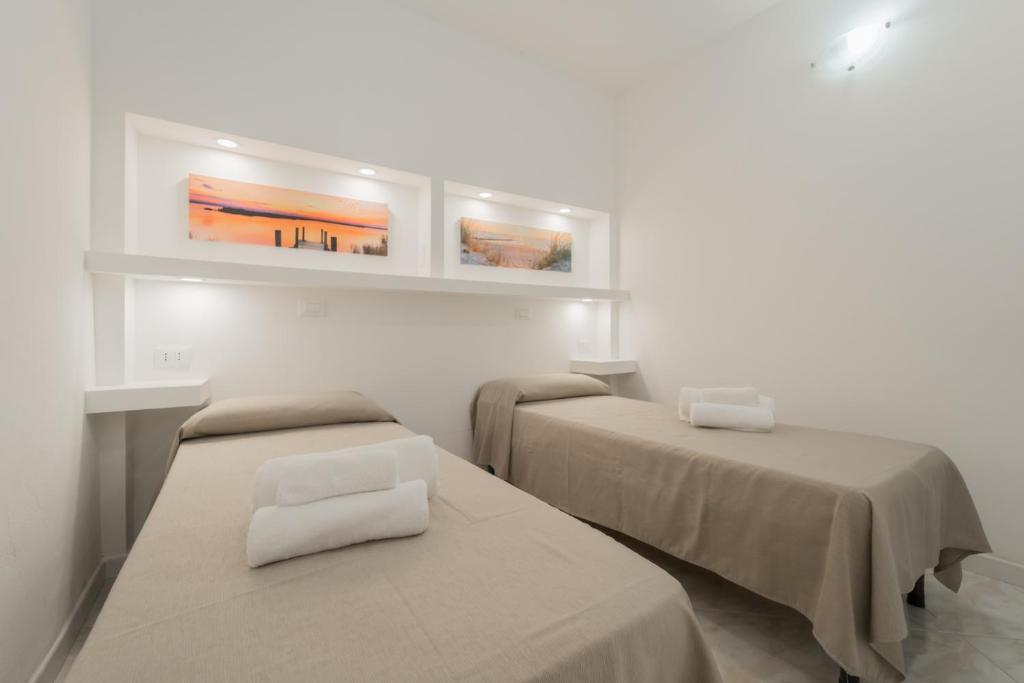 Кровать или кровати в номере Residence Cala Silente