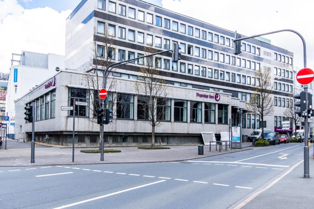 a building on the corner of a city street at Premier Inn Wuppertal City Centre in Wuppertal