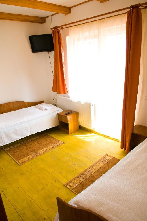 Postel nebo postele na pokoji v ubytování Casa Panorama Sovata