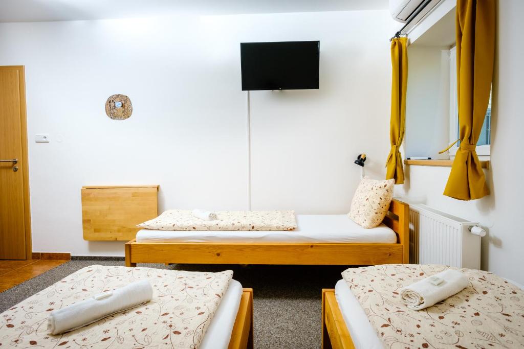 Postel nebo postele na pokoji v ubytování Pension U Blinků