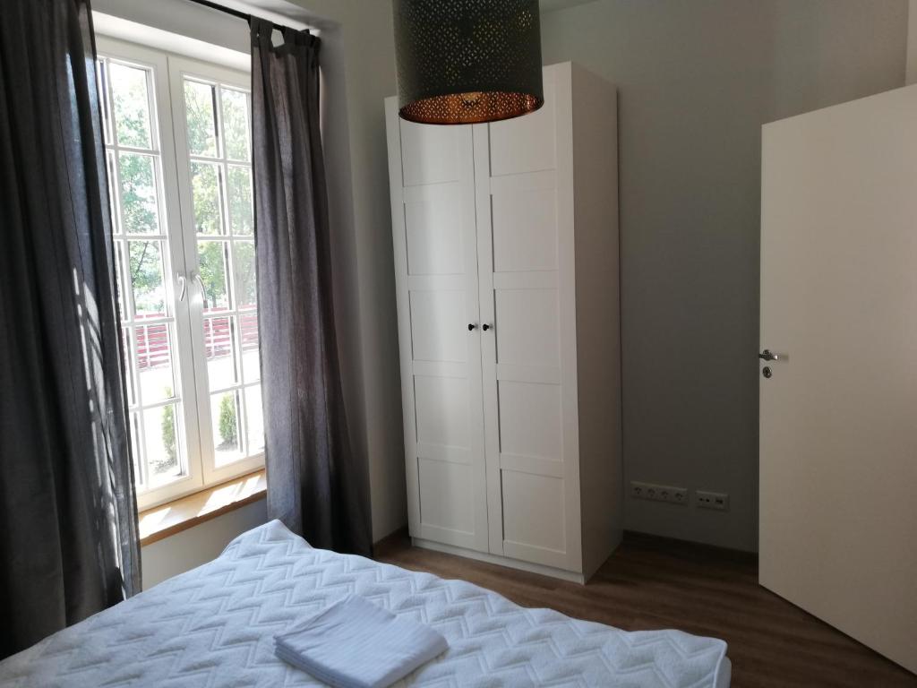 Postel nebo postele na pokoji v ubytování Just Rest Automatic Hostel