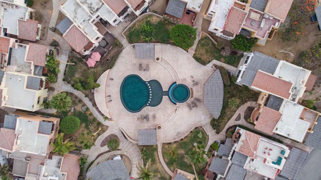 an aerial view of a swimming pool in a yard with houses at Private Villa in Gated Community Pet-Friendly in Cabo San Lucas