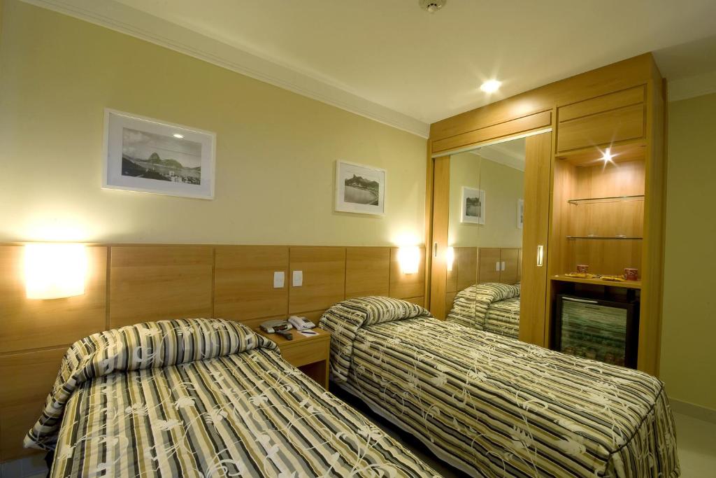 Postel nebo postele na pokoji v ubytování Hotel Atlântico Business Centro