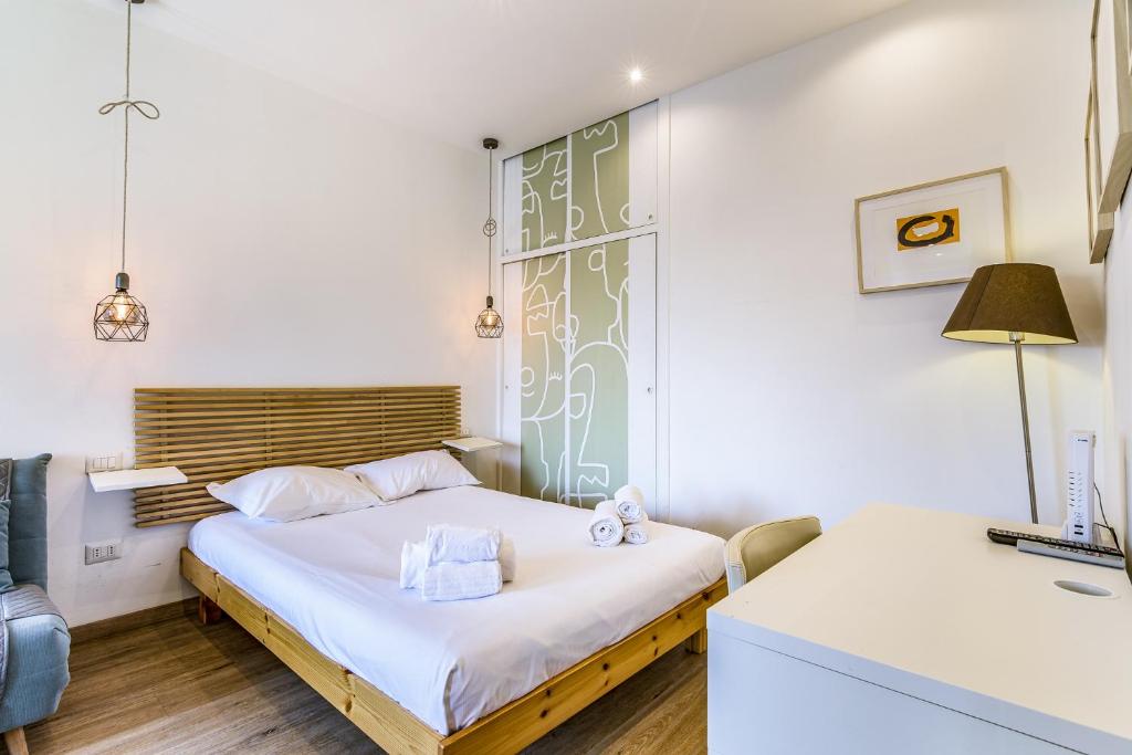 Postel nebo postele na pokoji v ubytování Travel Inside Srl - Ripa 127 Apartment Navigli