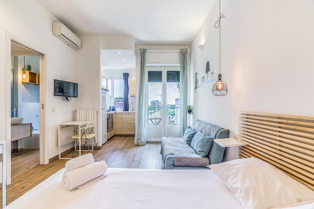 Postel nebo postele na pokoji v ubytování Travel Inside Srl - Ripa 127 Apartment Navigli