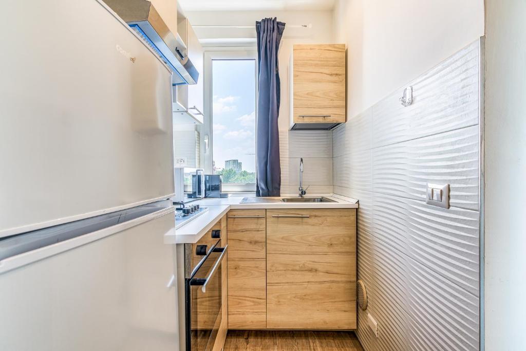 Kuchyň nebo kuchyňský kout v ubytování Travel Inside Srl - Ripa 127 Apartment Navigli