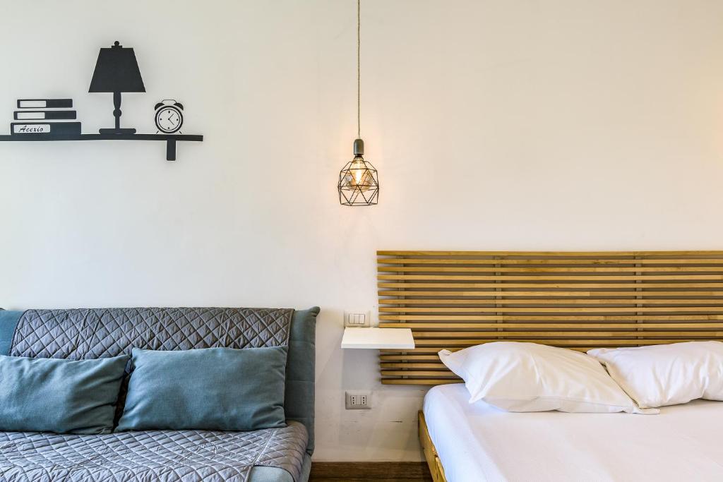 Postel nebo postele na pokoji v ubytování Travel Inside Srl - Ripa 127 Apartment Navigli