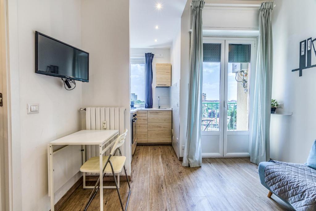 TV a/nebo společenská místnost v ubytování Travel Inside Srl - Ripa 127 Apartment Navigli