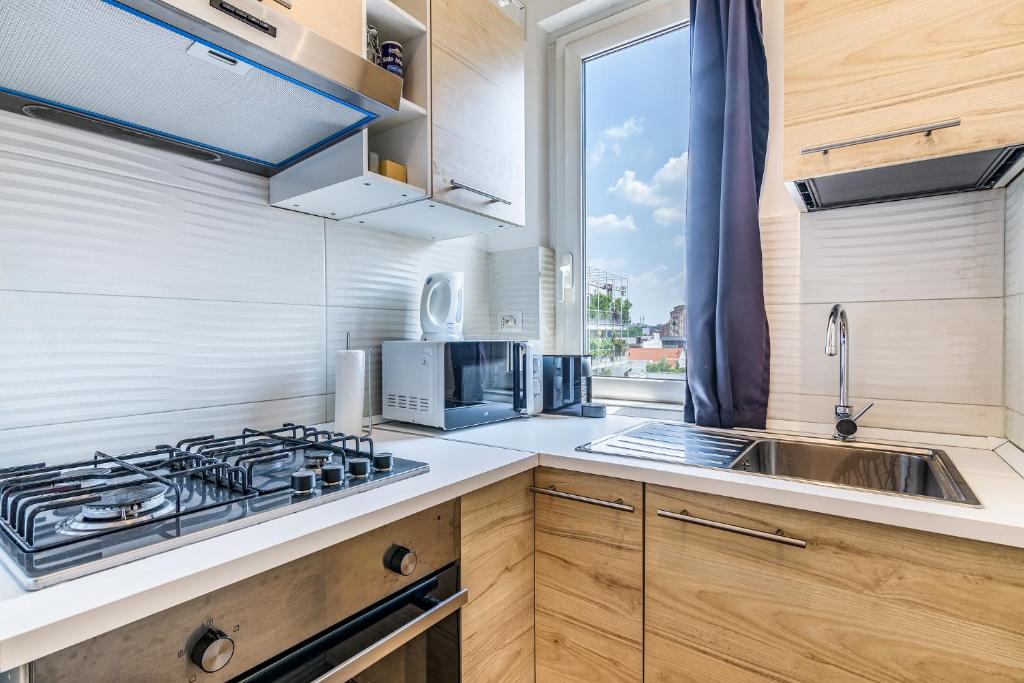 Kuchyň nebo kuchyňský kout v ubytování Travel Inside Srl - Ripa 127 Apartment Navigli