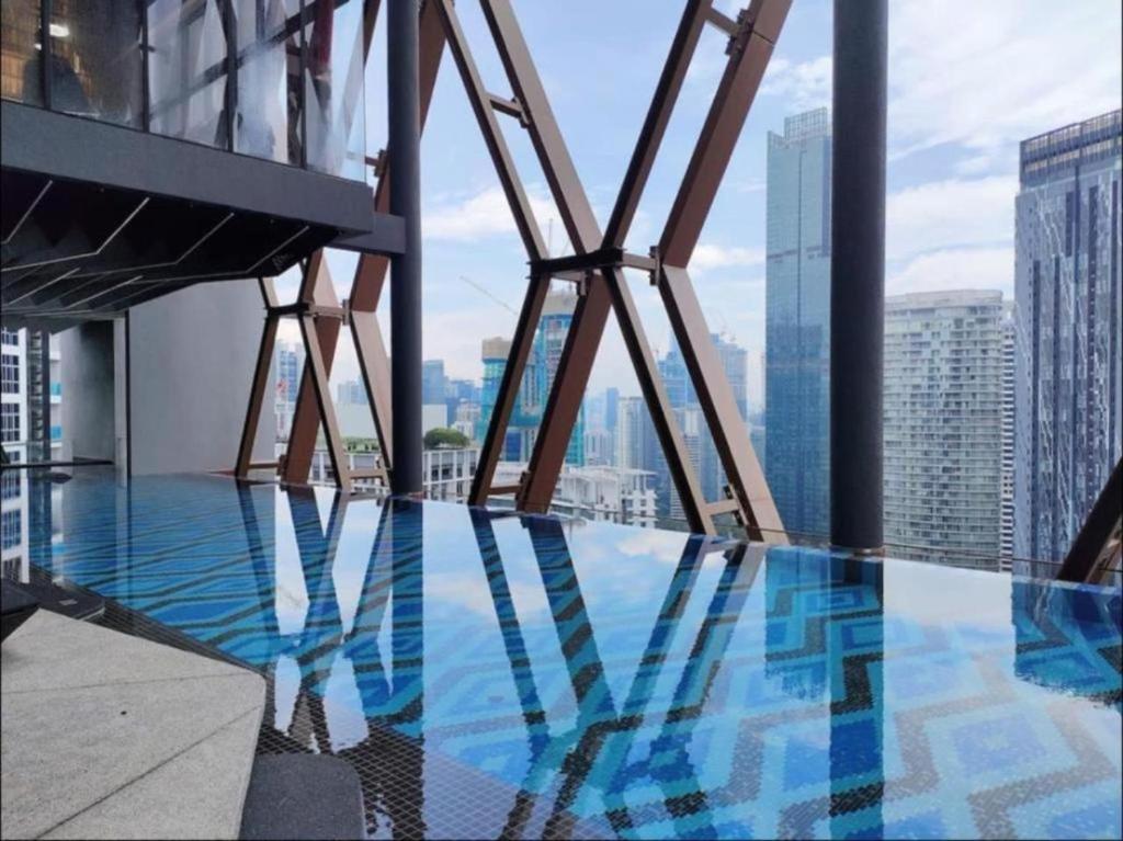 a view from the top of a building with a pool at Infinity Pool Scarletz Suites KLCC in Kuala Lumpur