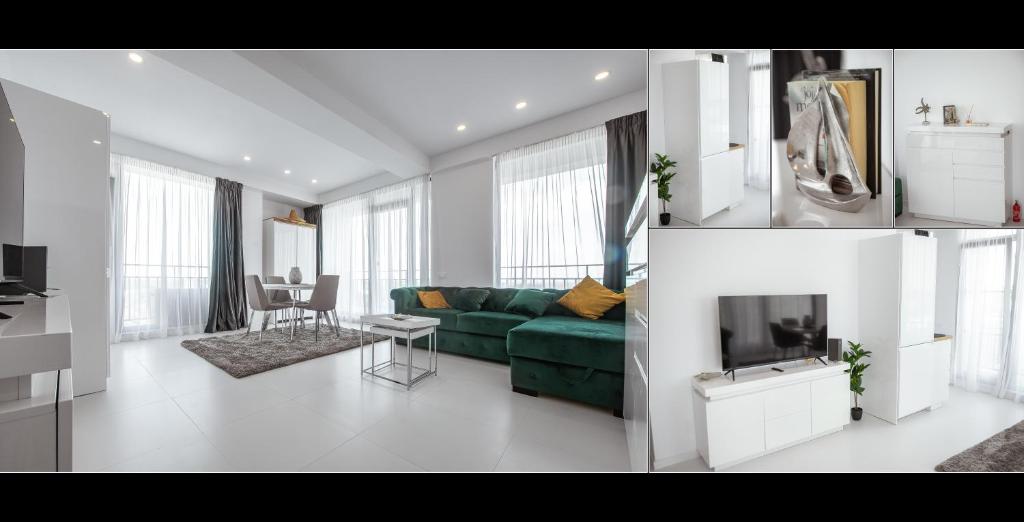 a living room with a green couch and a tv at Serenity by Oxygen Residence in Neptun
