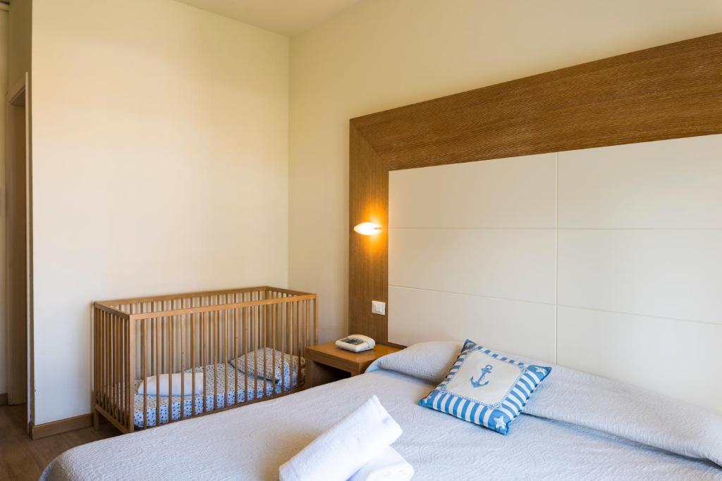 Postel nebo postele na pokoji v ubytování Hotel Sylvia
