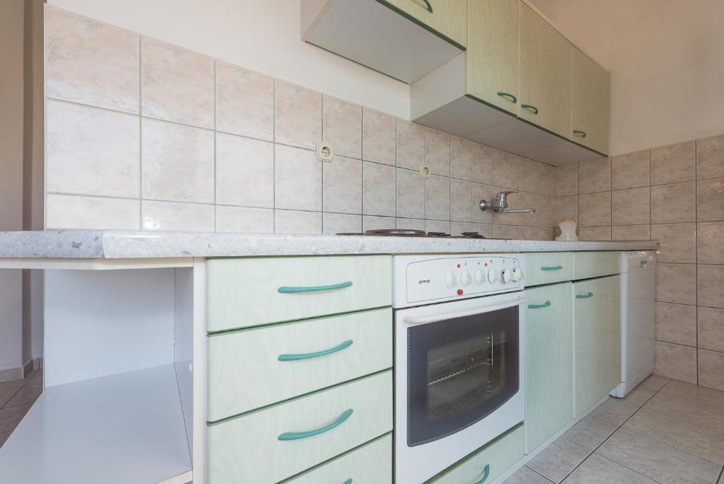 Kuchyň nebo kuchyňský kout v ubytování Apartments Remini