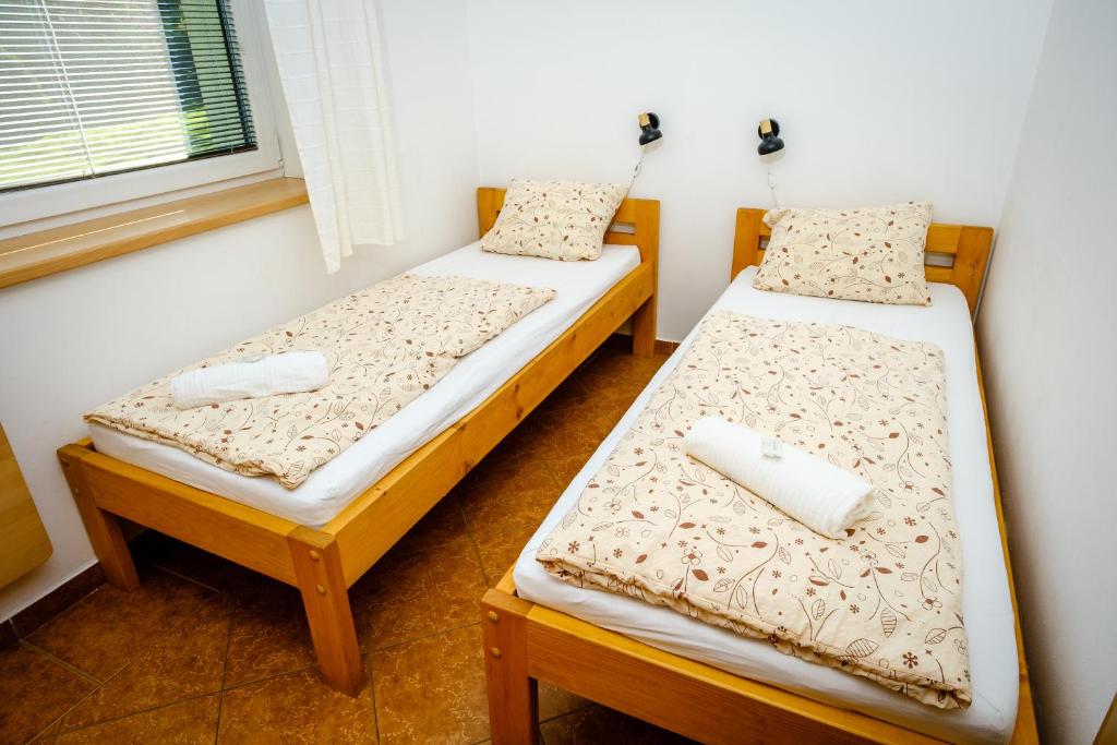 Postel nebo postele na pokoji v ubytování Pension U Blinků