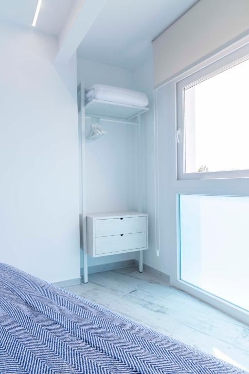 Postel nebo postele na pokoji v ubytování Hostal Boutique La Mar Serena