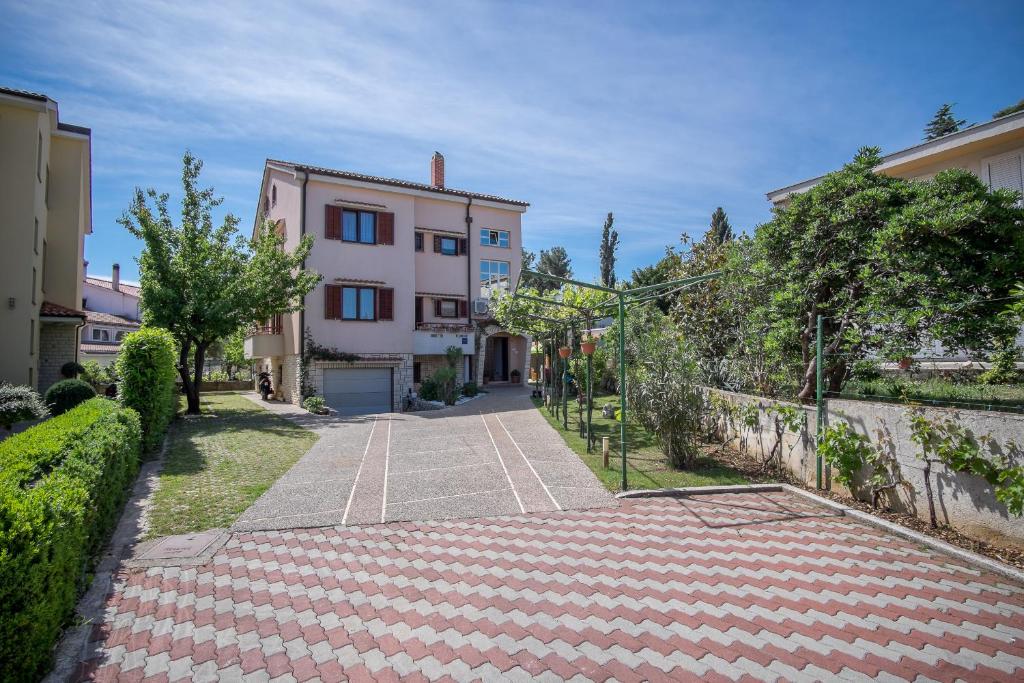 an empty street in front of a building at Apartments Durda in Krk