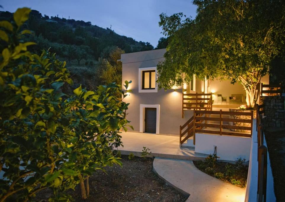 a house with a pathway leading up to it at River House in Kalymnos