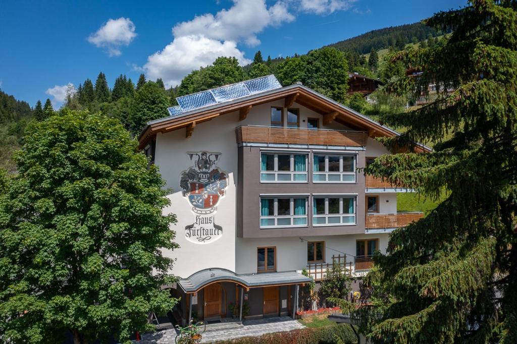 a building with solar panels on top of it at Appartements Fürstauer in Saalbach Hinterglemm