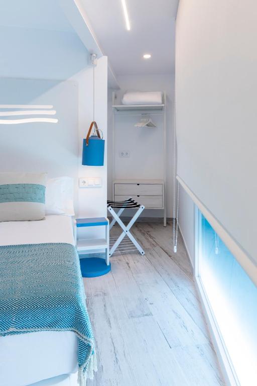 Postel nebo postele na pokoji v ubytování Hostal Boutique La Mar Serena