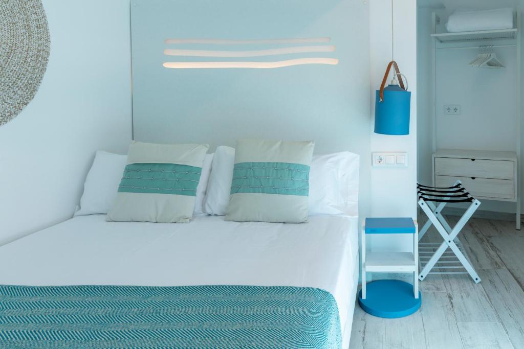 Postel nebo postele na pokoji v ubytování Hostal Boutique La Mar Serena