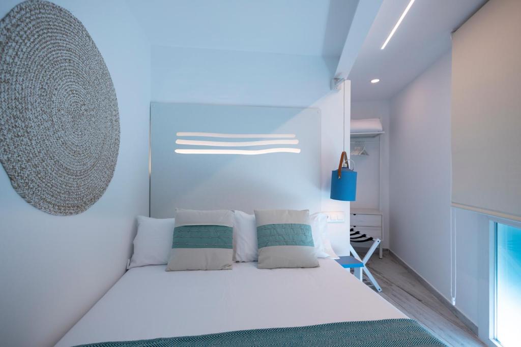 Postel nebo postele na pokoji v ubytování Hostal Boutique La Mar Serena