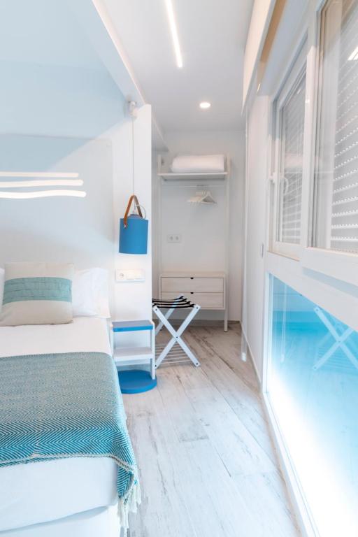 Postel nebo postele na pokoji v ubytování Hostal Boutique La Mar Serena