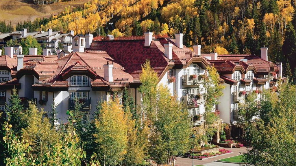a large group of houses in the mountains at Vail Sonnenalp King Hotel Room in Vail