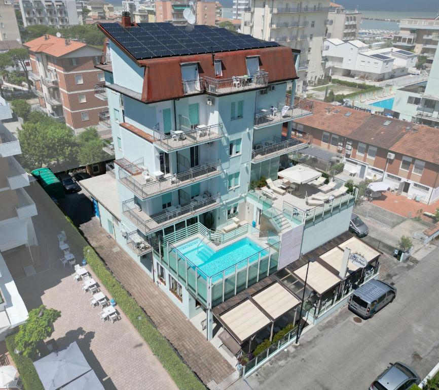 an aerial view of a building with a swimming pool at Hotel Bahamas in Lido di Savio