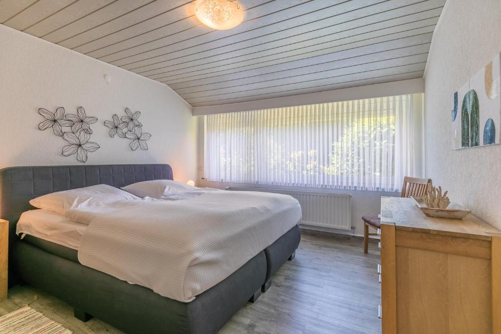 Postel nebo postele na pokoji v ubytování "Nordseetraum" Nordseetraum, Bungalow