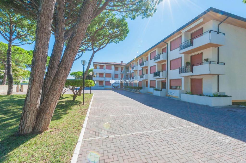a brick sidewalk in front of a building at Park Residence Immobiliare Pacella in Lido di Jesolo