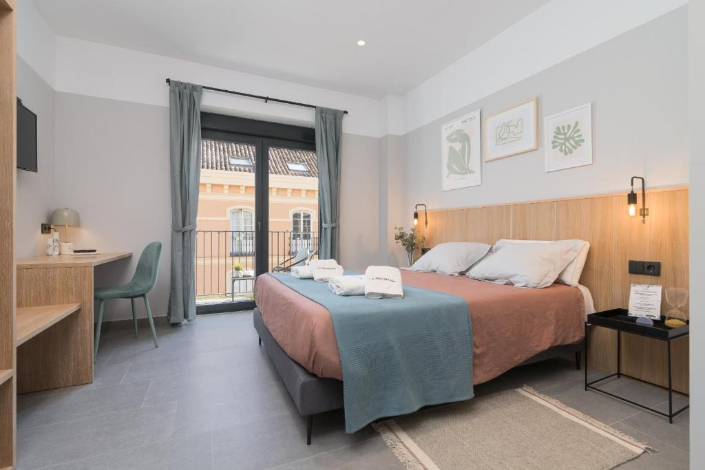 Posteľ alebo postele v izbe v ubytovaní Victoria Suites 57
