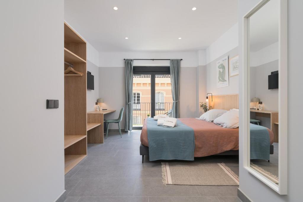 Posteľ alebo postele v izbe v ubytovaní Victoria Suites 57