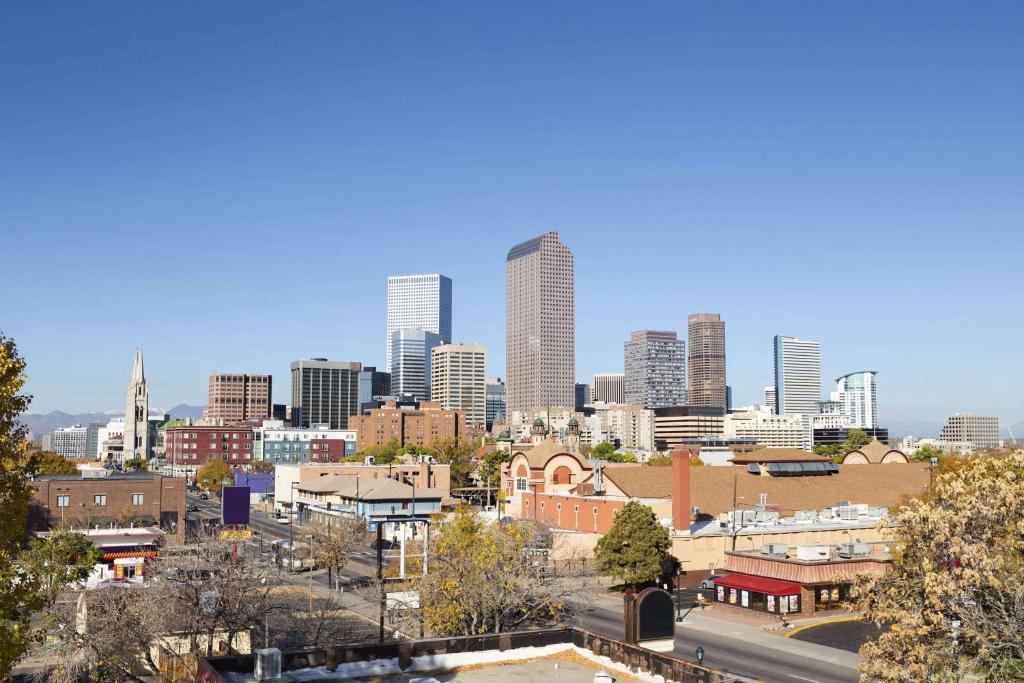 a view of a city skyline with tall buildings at Days Inn by Wyndham Denver Downtown in Denver