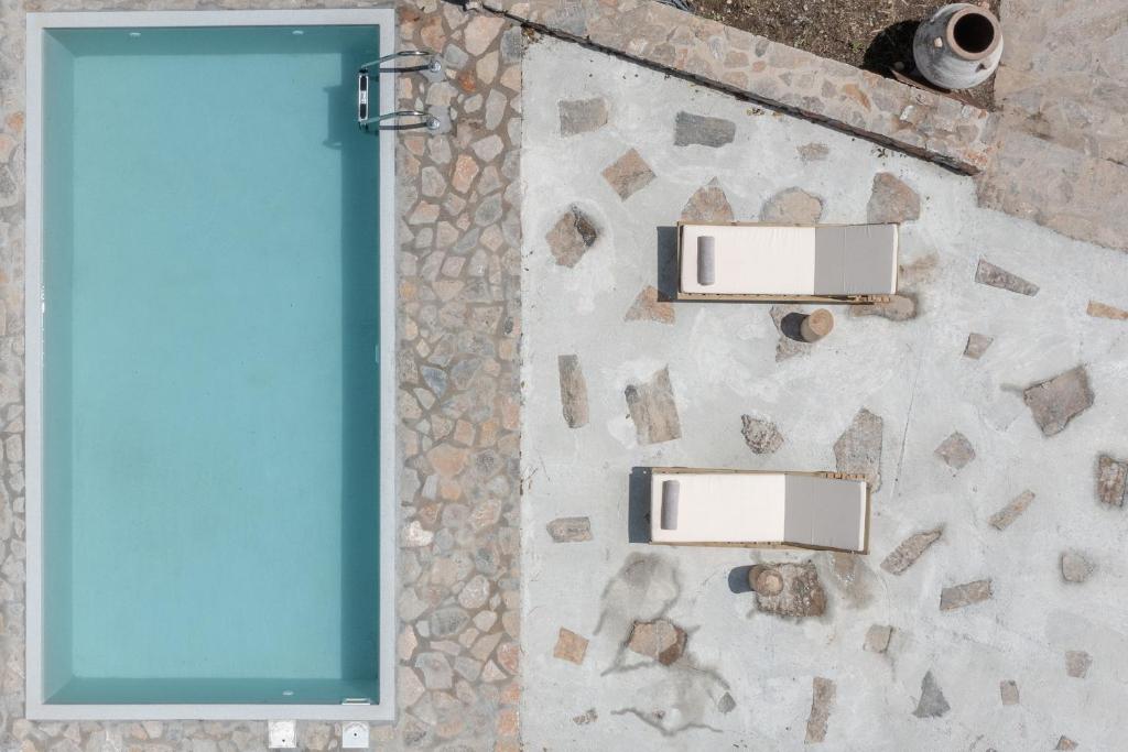a mirror on the wall of a bathroom at Nomas Home Imbros with Private Pool in Hora Sfakion